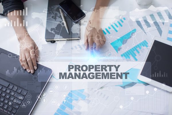 Woman working with documents, Tablet pc and notebook. Property management Concept.